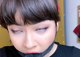 kinda goth asian girl gags herself